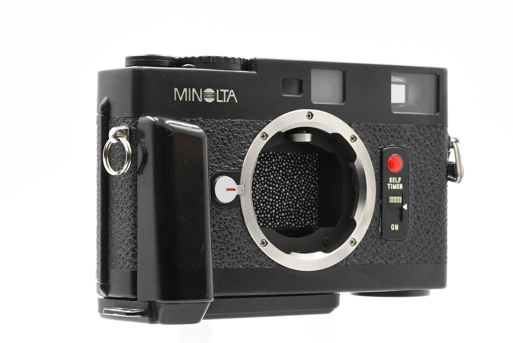 MINOLTA CLE + GRIP SN. 1011054